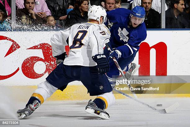 Kevin Klein of the Nashville Predators defends against Jiri Tlusty of the Toronto Maple Leafs during their NHL game at the Air Canada Centre January...
