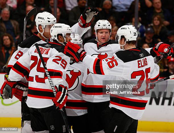 Brian Gionta of the New Jersey Devils is congratulated by teammates after scoring on the Vancouver Canucks during their game at General Motors Place...