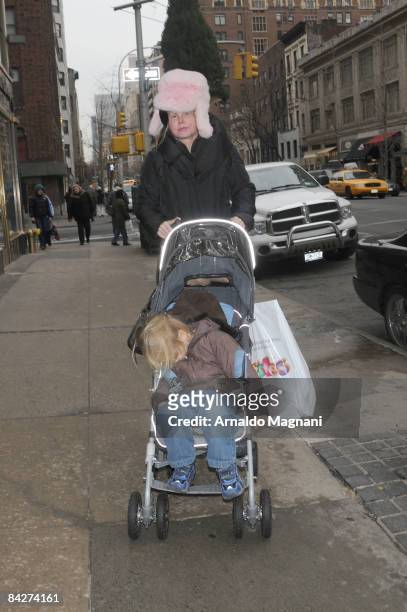 Kim Garfunkel, wife of singer Art Garfunkel, walks on Madison Avenue with son Daniel January 13, 2009 in New York City.