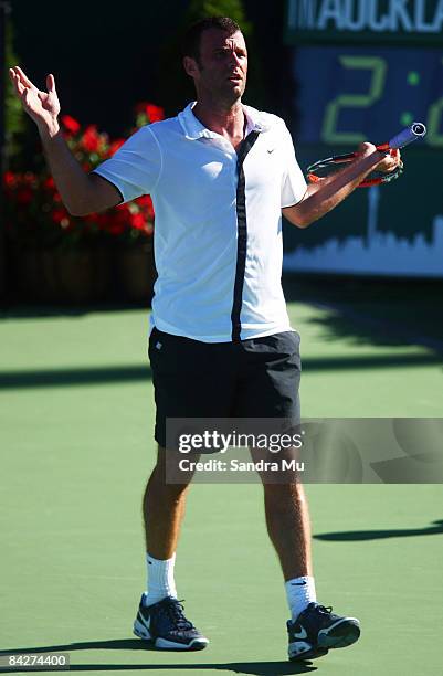 Marc Gicquel of France questions the umpire in his second round match against David Ferrer of Spain during day three of the Heineken Open at ASB...