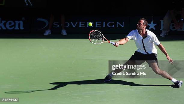 Marc Gicquel of France plays a forehand in his second round match against David Ferrer of Spain during day three of the Heineken Open at ASB Tennis...