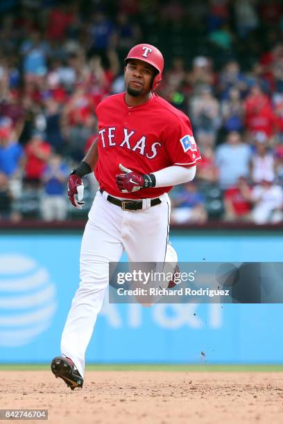 Elvis Andrus of the Texas Rangers rounds the bases after a home run against the Los Angeles Angels of Anaheim at Globe Life Park in Arlington on...