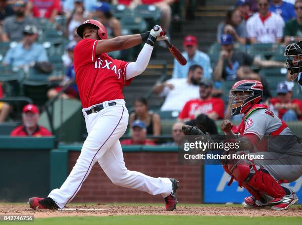 Elvis Andrus of the Texas Rangers hits a home run against the Los Angeles Angels of Anaheim at Globe Life Park in Arlington on September 3, 2017 in...