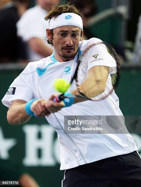 Juan Carlos Ferrero of Spain plays a backhand in his second round match against Philipp Kohlschreiber of Germany during day three of the Heineken...