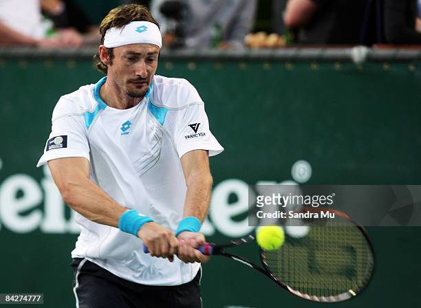 Juan Carlos Ferrero of Spain plays a backhand in his second round match against Philipp Kohlschreiber of Germany during day three of the Heineken...