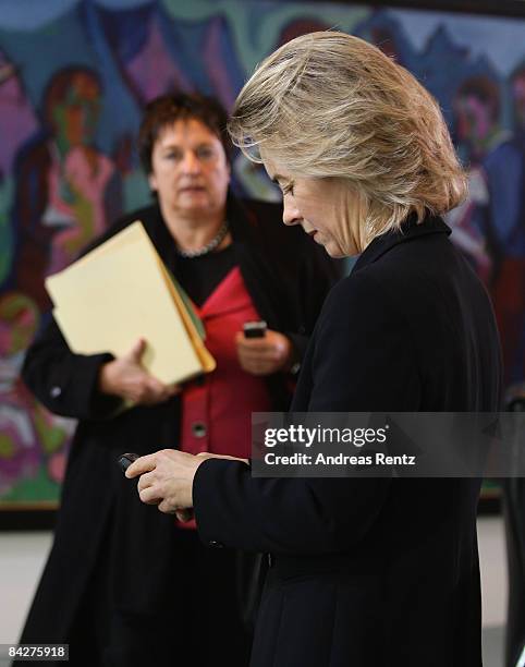 German Family Minister Ursula von der Leyen uses her cell phone prior to the weekly German government cabinet meeting on January 14, 2009 in Berlin,...