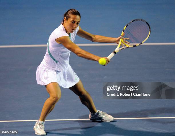 Francesca Schiavone of Italy returns a shot to Edina Gallovitis of Romania and Arantxa Parra Santonja of Spain during their double match on day six...