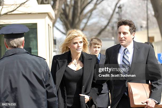 Former Playboy Playmate Anna Nicole Smith and her attorney Howard Stern leave the US Supreme Court in Washington, DC Tuesday afternoon after there...