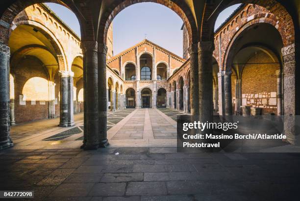 view of the façade of basilica of sant'ambrogio from the ansperto atrium - milan photos et images de collection
