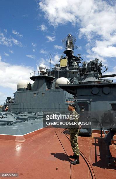 Guard on board the Russian missile cruiser, "Peter the Great", is anchored in Table Bay Harbour, in Cape Town, on January 14, 2009. This nuclear...