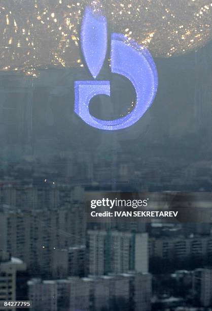 The Russian Gazprom emblem is reflected in the window of the office of its Chief Executive Officer Alexei Miller before his meeting with Slovak Prime...