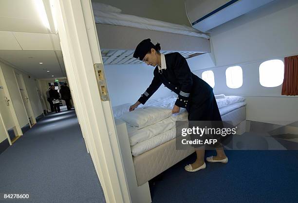 Local Manager Gisela Olsson makes a bed in one of the standard rooms of the Jumbo Hostel, reportedly the worlds first hostel in an airplane, at...