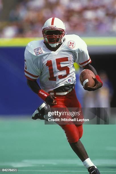 Tommy Frazier of the Nebraska Cornhuskers runs with the ball during a college football game against the West Virginia Mountaineers on August 31, 1994...