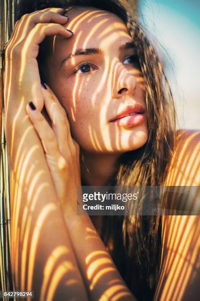portrait of beautiful woman on the beach - summer fashion model stock pictures, royalty-free photos & images