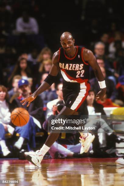 Clyde Drexler#22 of the Portland Trailblazers dribbles up court during a NBA basketball game against the Washington Bullets on January 7, 1995 at...