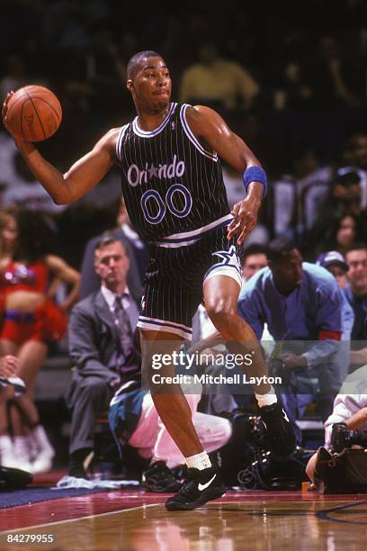 Anthony Avent of the Orlando Magic looks to pass the ball during a NBA basketball game against the Washington Bullets on April 19, 1995 at USAir...