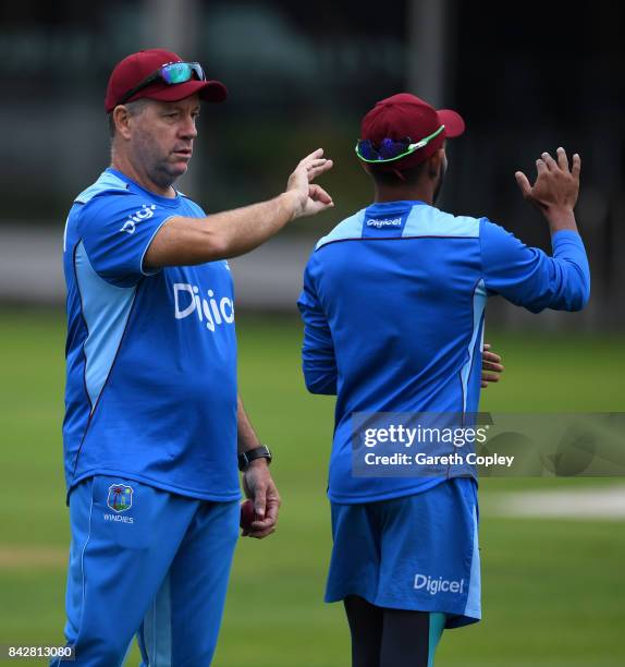 West Indies coach Stuart Law speaks with Devendra Bishoo during a nets session at Lord's Cricket Ground on September 5, 2017 in London, England.