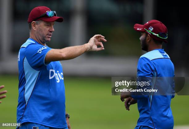 West Indies coach Stuart Law speaks with Devendra Bishoo during a nets session at Lord's Cricket Ground on September 5, 2017 in London, England.