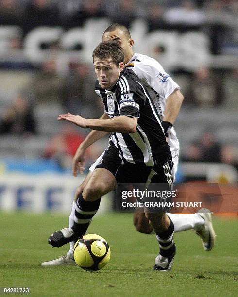 Michael Owen of Newcastle vies with Craig Fagan of Hull during an FA Cup, 3rd round replay, football match between Newcastle United and Hull City at...