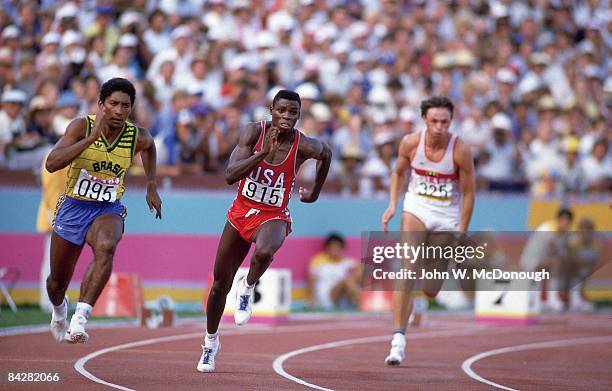 Summer Olympics: USA Carl Lewis in action, leading race vs Brazil Joao Batista da Silva and West Germany Ralf Lubke during Men's 200M Semifinals Heat...