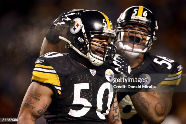 Linebacker Larry Foote of the Pittsburgh Steelers is congratulated by teammate LaMarr Woodley en route to his team's 35-24 victory over the San Diego...