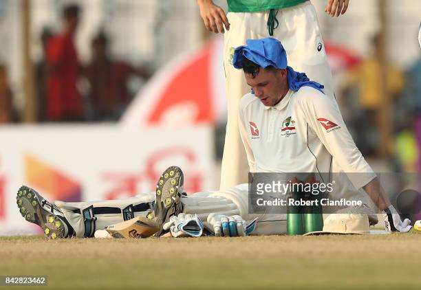 Peter Handscomb of Australia appears affected by the heat during day two of the Second Test match between Bangladesh and Australia at Zahur Ahmed...