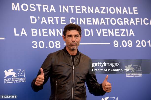 Italian actor Alessandro Gassmann attends the photocall of the movie "Gatta Cenerentola" presented in the "Orizzonti" selection at the 74th Venice...