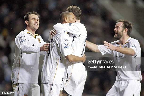 Daniel Cousin celebrates his goal for Hull with Richard Garcia, Ryan France and Ian Ashbee during an FA Cup, 3rd round replay, football match between...