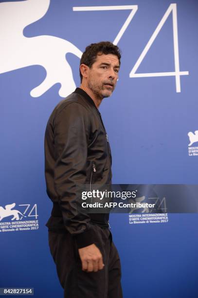 Italian actor Alessandro Gassmann attends the photocall of the movie "Gatta Cenerentola" presented in the "Orizzonti" selection at the 74th Venice...