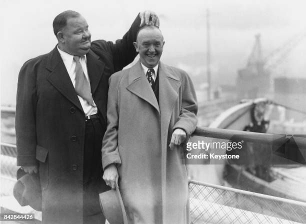 Comic duo Oliver Hardy and Stan Laurel arrive at Southampton on board the liner 'Queen Elizabeth', 10th February 1947.
