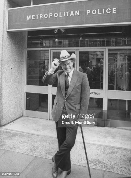 American actor Larry Hagman outside the headquarters of the Metropolitan Police in New Scotland Yard, London, whilst in character as J.R. Ewing from...