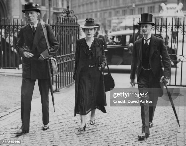 British politician Edward Wood, 1st Earl of Halifax and former Prime Minister Neville Chamberlain arrive at Westminster Abbey in London with...