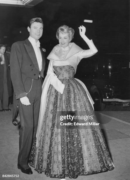 Lithuanian-born actor Laurence Harvey and actress Arlene Dahl arrive at the Empire Theatre in Leicester Square, London, for the Royal Film...