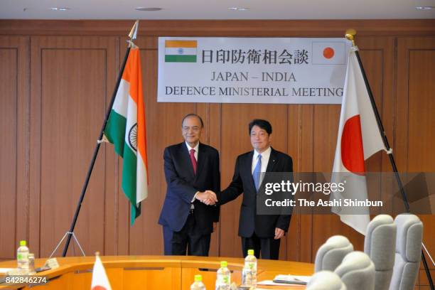 Indian Defense Minister Arun Jaitley shakes hands with Japanese Defense Minister Itsunori Onodera prior to their meeting at the Defense Ministry on...