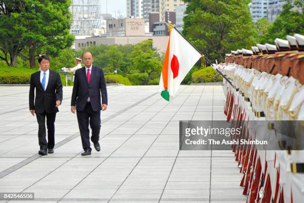 Indian Defense Minister Arun Jaitley reviews the honour guard with Japanese Defense Minister Itsunori Onodera during the welcome ceremony at the...