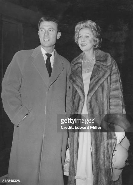 Lithuanian-born actor Laurence Harvey and his wife, English actress Margaret Leighton , arrive at Waterloo Station in London on the 'United States'...