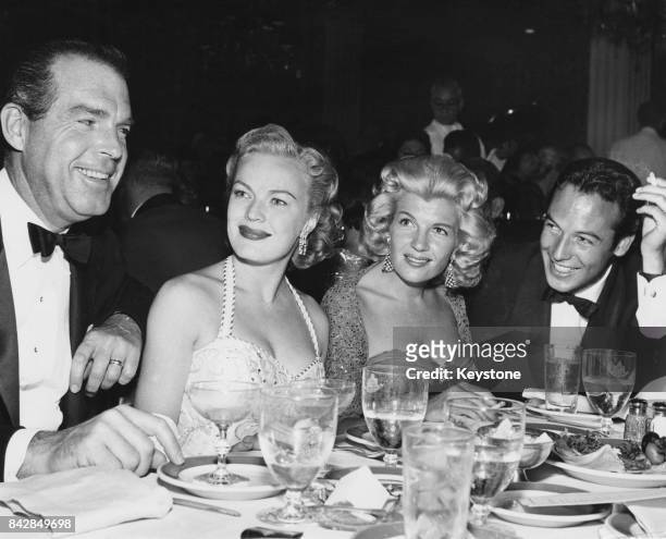 From left to right, American actor Fred MacMurray , his wife, actress June Haver , actress Corinne Calvet and her husband, actor Jeffrey Stone, out...