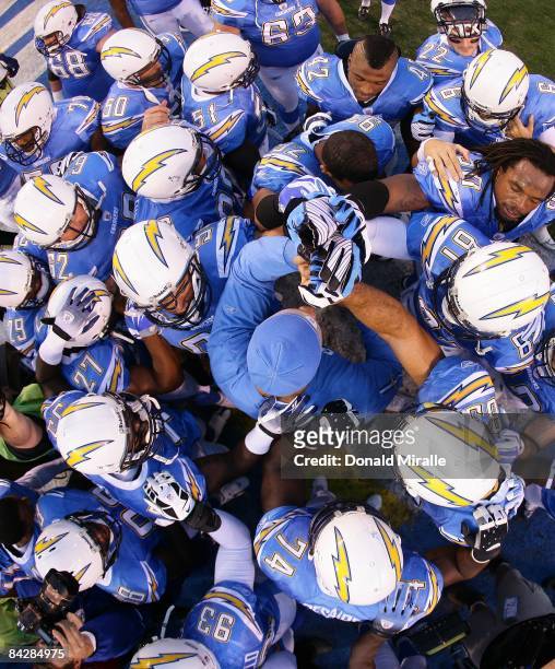 The San Diego Chargers huddle before entering the game against the Indianapolis Colts during the Chargers 23-17 sudden death overtime win in the NFL...