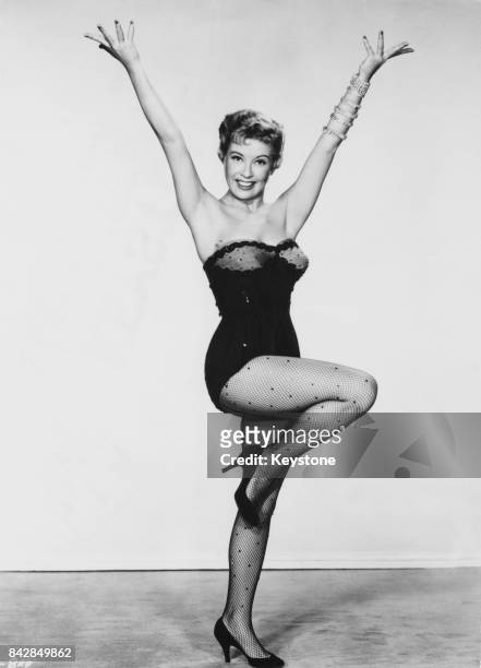 American actress and singer Gloria DeHaven as a nightclub singer in the musical comedy 'So This Is Paris', 1955. In the film, she sings the song 'I...
