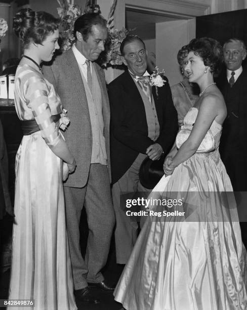 Princess Margaret meets actors Julie Andrews, Rex Harrison and Stanley Holloway in the Royal Box at the Theatre Royal on Drury Lane, London, after a...