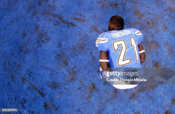 Running back LaDainian Tomlinson of the San Diego Chargers stretches on the field before the start against the Indianapolis Colts during the Chargers...