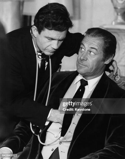 American actors Rex Harrison and Cliff Robertson in a scene from the film 'The Tale of the Fox', later titled 'The Honey Pot', in Italy, October 1965.