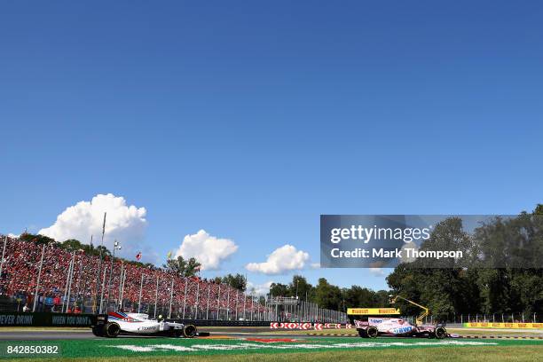 Esteban Ocon of France driving the Sahara Force India F1 Team VJM10 leads Lance Stroll of Canada driving the Williams Martini Racing Williams FW40...