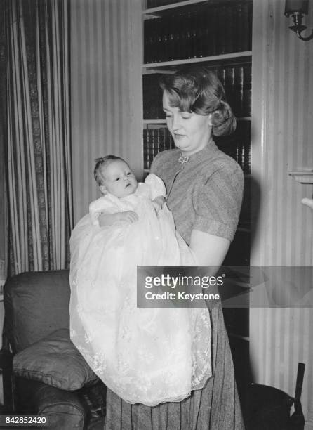 Pamela Churchill Harriman, the wife of Randolph Churchill, holding her son Winston, the grandson of former Prime Minister Winston Churchill, 23rd...