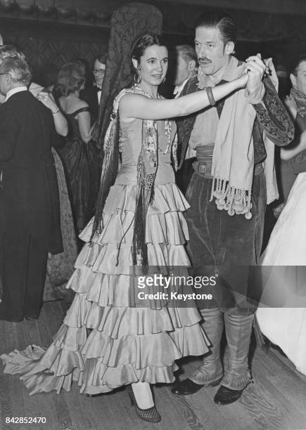 The 7th Earl of Harewood and the Countess of Harewood in Spanish dress for the Opera Ball at the Dorchester Hotel in London, 13th February 1958. The...