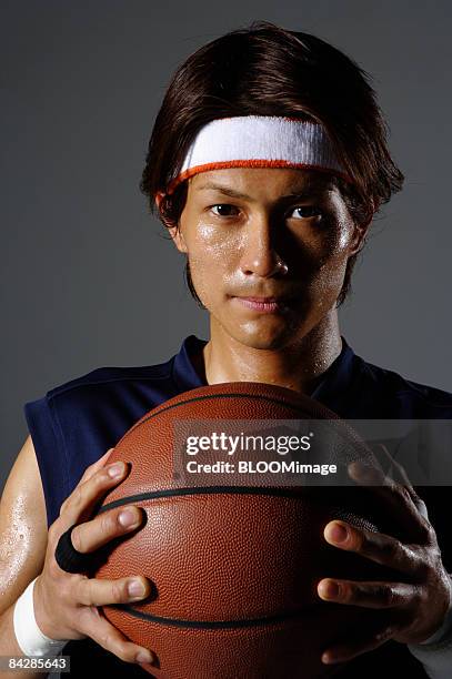 basketball player with ball, portrait, close-up, studio shot - basketball close up ストックフォトと画像