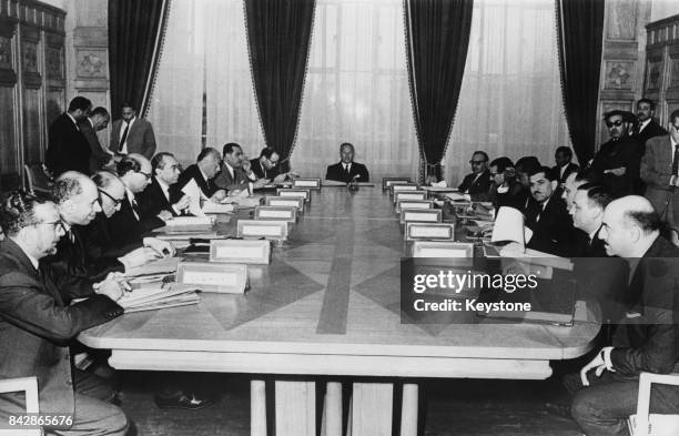 Abdul Khalek Hassouna , Secretary-General of the Arab League, presides over a meeting of the committee of personal representatives of the Arab heads...