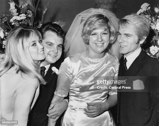 Songwriters Jackie Trent and Tony Hatch during their wedding reception at the Europa Hotel in London, with singer Adam Faith and dancer Jackie Irving...