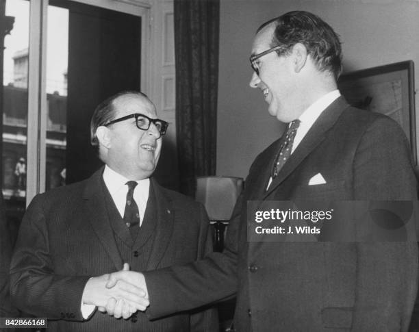 Sir Joshua Hassan , the Chief Minister of Gibraltar, meets George Thomson , the Commonwealth Secretary, at the Commonwealth Office in London, for...