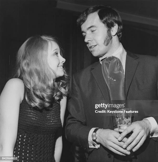 English actress Linda Hayden , who is making her debut in the film 'Baby Love', chats with songwriter Barry Mason, composer of 'Delilah', at...